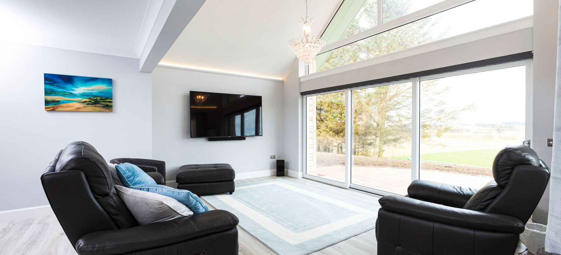 Open-plan living area, including lounge, kitchen and dining space. 